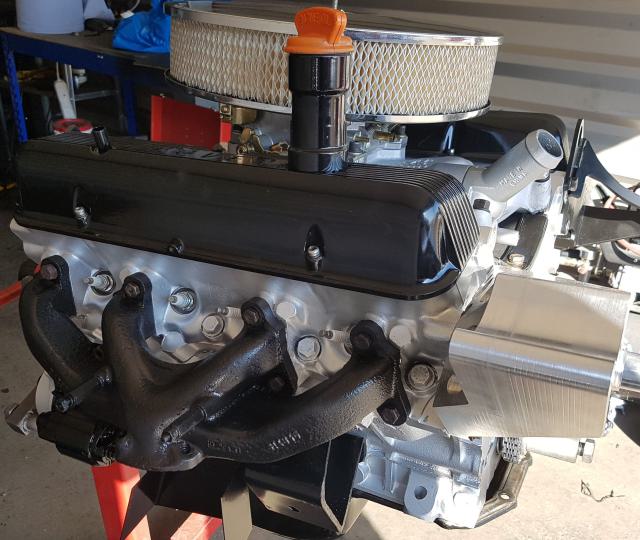 Rebuilt Rover V8 engine with Edelbrock carburettor and restored exhaust manifolds