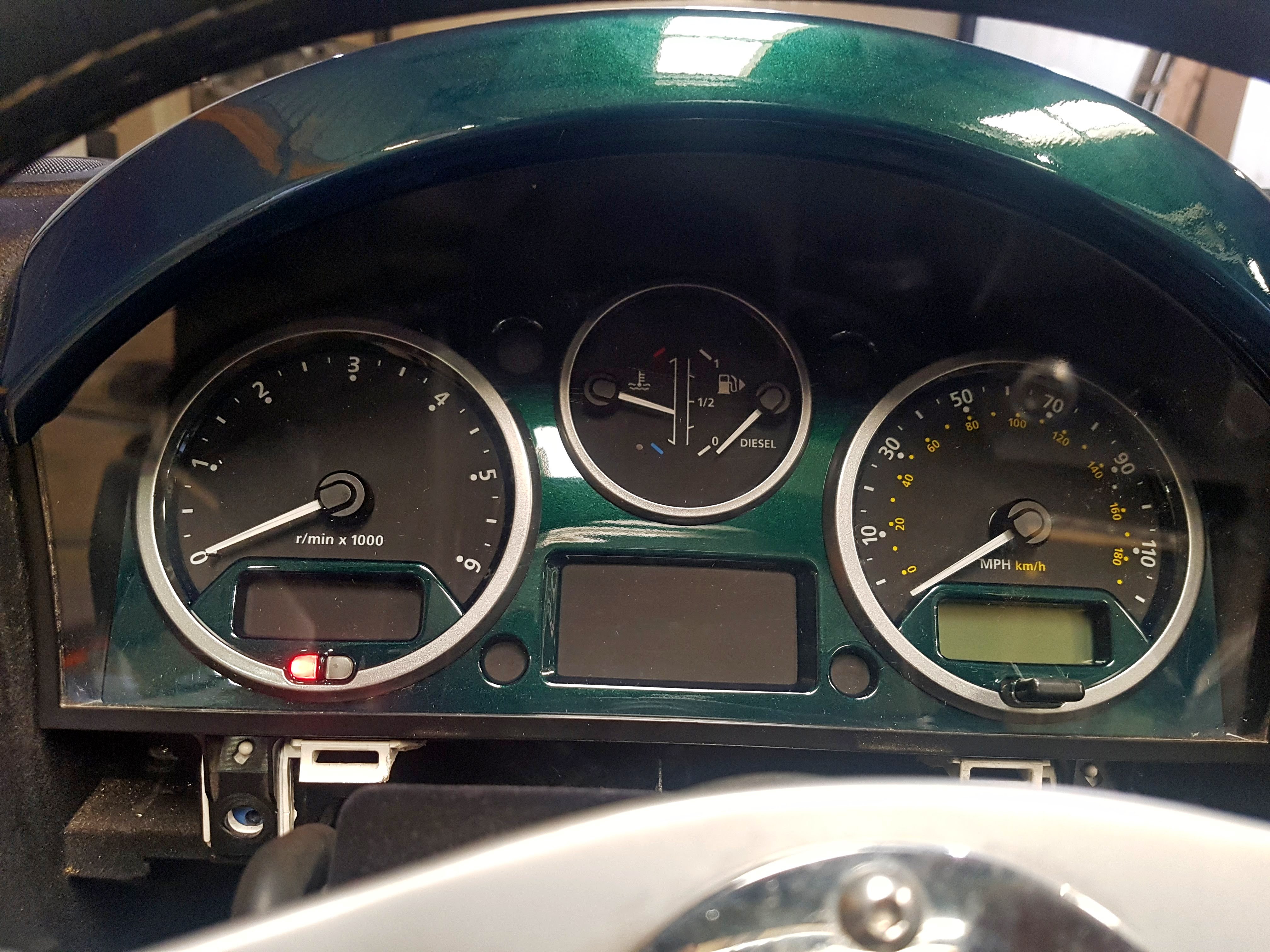 Modified Land Rover Defender dashboard with original-style instrumentation